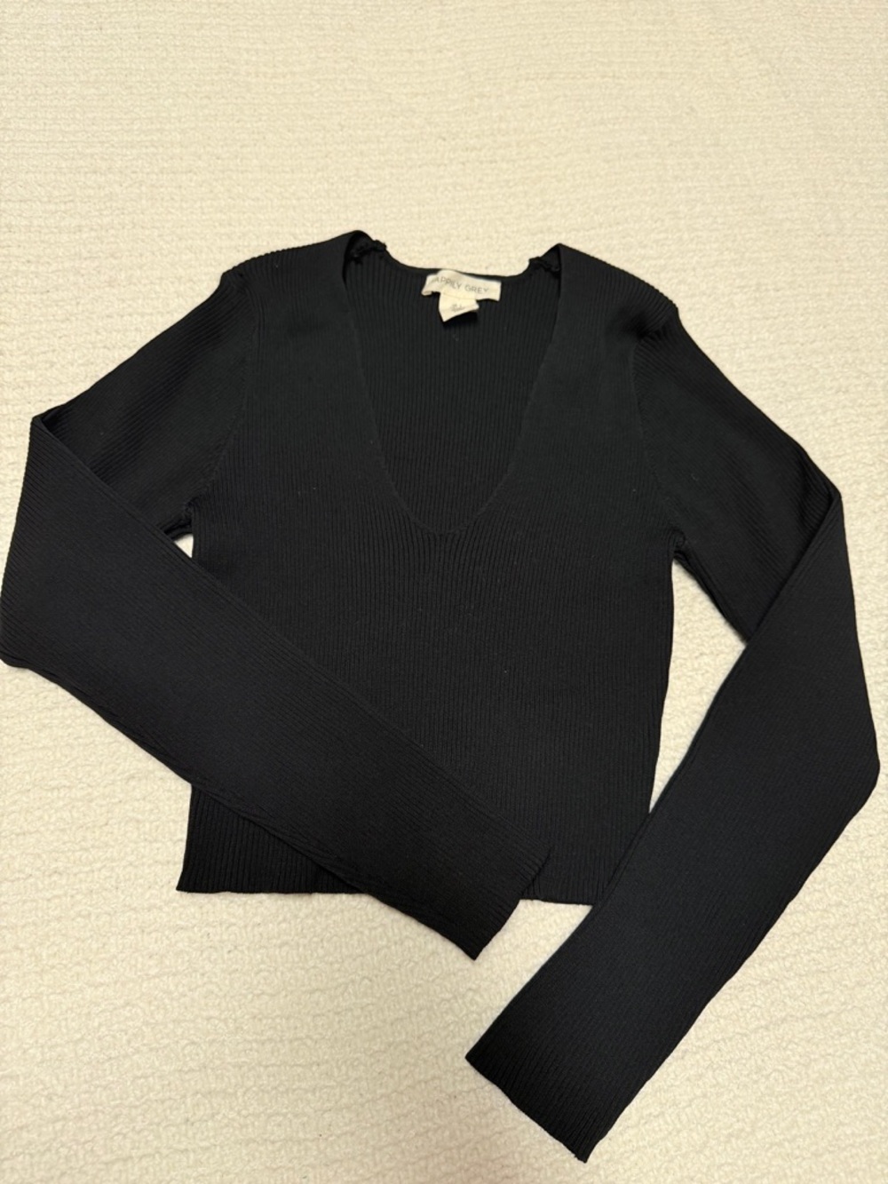 Black Ribbed V-Neck Long Sleeve Top by Aritzia
